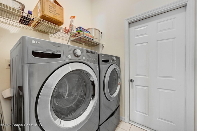 1067 Red Bud Cir, Rockledge, FL 32955 - washroom with separate washer and dryer and light tile patterned floors