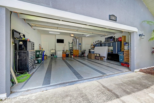 1067 Red Bud Cir, Rockledge, FL 32955 - garage with a garage door opener