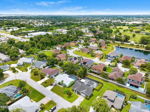 1067 Red Bud Cir, Rockledge, FL 32955 - aerial perspective of suburban area featuring a large body of water