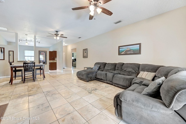 1067 Red Bud Cir, Rockledge, FL 32955 - living room featuring ceiling fan and light tile patterned floors