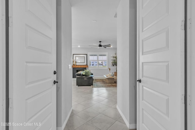 10035 SW Captiva Dr, Port St Lucie, FL 34987 - hallway with baseboards and light tile patterned flooring