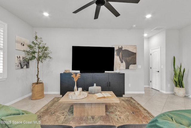 10035 SW Captiva Dr, Port St Lucie, FL 34987 - tiled living room with ceiling fan and recessed lighting