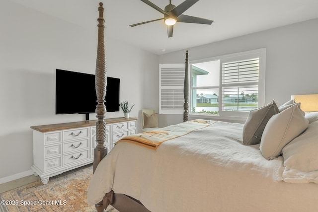 10035 SW Captiva Dr, Port St Lucie, FL 34987 - bedroom with baseboards and ceiling fan