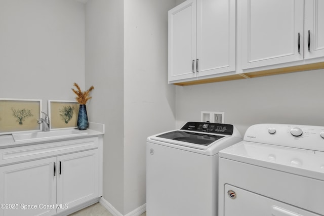 10035 SW Captiva Dr, Port St Lucie, FL 34987 - laundry area featuring independent washer and dryer and cabinet space
