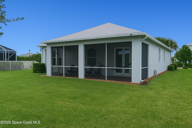 10035 SW Captiva Dr, Port St Lucie, FL 34987 - back of house with stucco siding, a sunroom, and a shingled roof