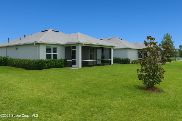 10035 SW Captiva Dr, Port St Lucie, FL 34987 - back of property featuring a yard, a sunroom, and stucco siding