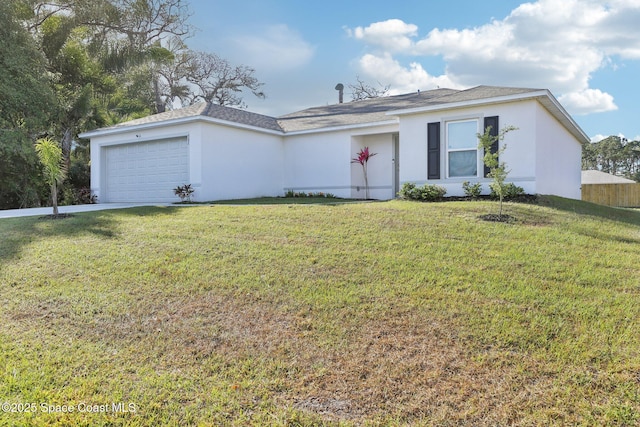982 Pyracantha St NW, Palm Bay, FL 32907 - ranch-style house with a garage, stucco siding, a front lawn, and driveway