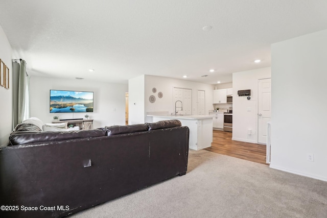 982 Pyracantha St NW, Palm Bay, FL 32907 - living room with light carpet and recessed lighting