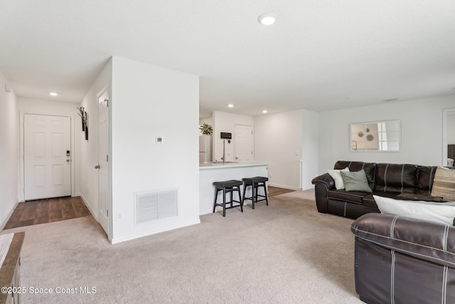 982 Pyracantha St NW, Palm Bay, FL 32907 - carpeted living room with recessed lighting