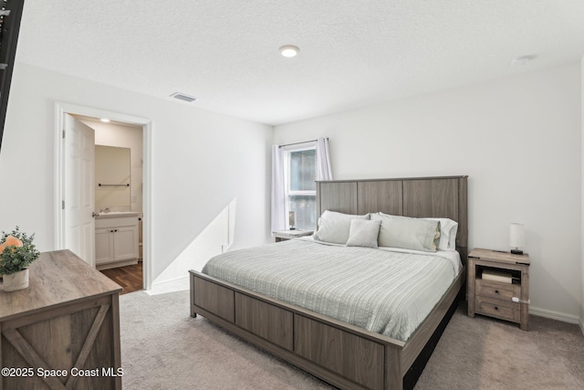 982 Pyracantha St NW, Palm Bay, FL 32907 - bedroom with light colored carpet and connected bathroom