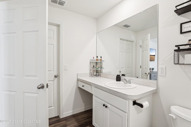 982 Pyracantha St NW, Palm Bay, FL 32907 - bathroom with vanity and wood finished floors