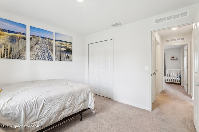 982 Pyracantha St NW, Palm Bay, FL 32907 - bedroom featuring light colored carpet and a closet
