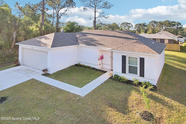 982 Pyracantha St NW, Palm Bay, FL 32907 - view of front of property featuring a front lawn, a garage, a shingled roof, stucco siding, and concrete driveway