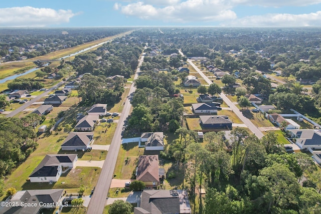 982 Pyracantha St NW, Palm Bay, FL 32907 - aerial overview of property's location with nearby suburban area and a large body of water