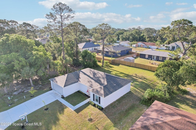 982 Pyracantha St NW, Palm Bay, FL 32907 - aerial perspective of suburban area featuring a tree filled landscape