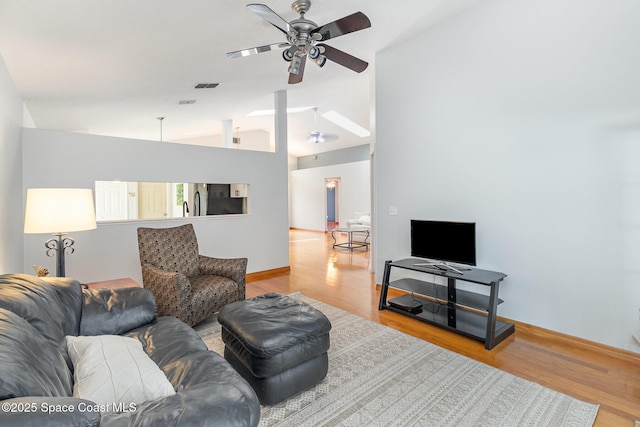 1459 Crane Creek Blvd, Melbourne, FL 32940 - living room with ceiling fan, lofted ceiling, and wood finished floors