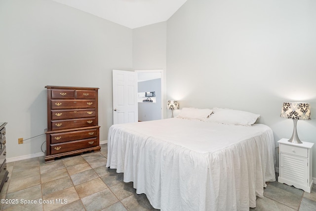 1459 Crane Creek Blvd, Melbourne, FL 32940 - bedroom featuring baseboards and light stone finish floors