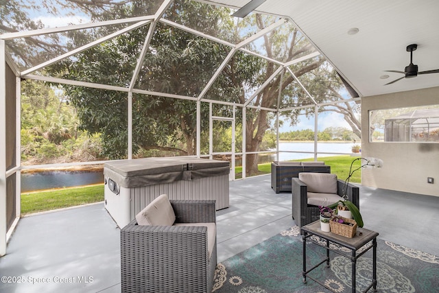 1459 Crane Creek Blvd, Melbourne, FL 32940 - view of patio / terrace featuring a hot tub, a water view, ceiling fan, and a lanai