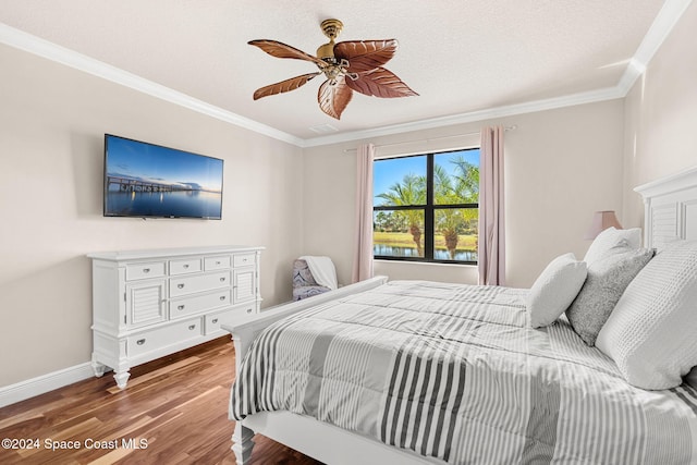 8522 Strom Park Dr, Melbourne, FL 32940 - bedroom with wood finished floors, ornamental molding, and ceiling fan