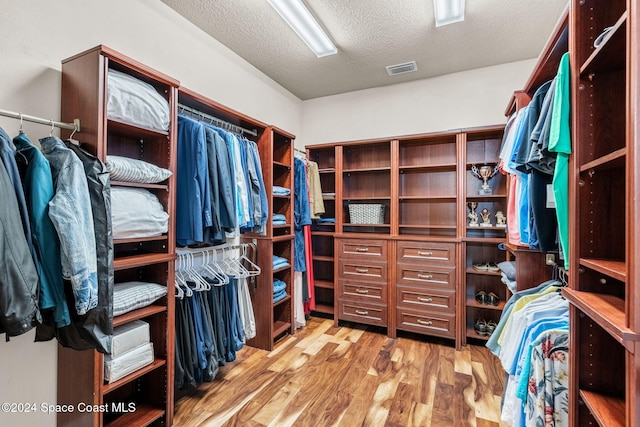 8522 Strom Park Dr, Melbourne, FL 32940 - spacious closet featuring wood finished floors