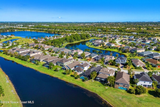 8522 Strom Park Dr, Melbourne, FL 32940 - aerial view of property and surrounding area featuring nearby suburban area and a large body of water