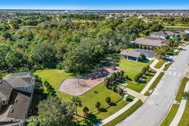 8522 Strom Park Dr, Melbourne, FL 32940 - aerial perspective of suburban area featuring a large body of water and a tree filled landscape