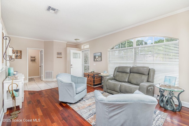 1510 Gardenton St NW, Palm Bay, FL 32907 - living area featuring wood finished floors and ornamental molding
