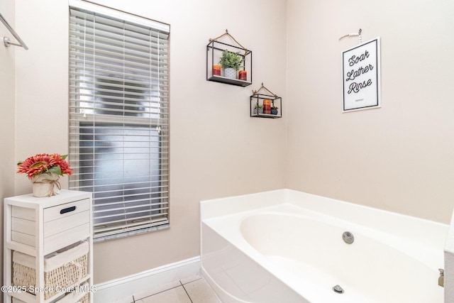1510 Gardenton St NW, Palm Bay, FL 32907 - bathroom with a garden tub and tile patterned flooring