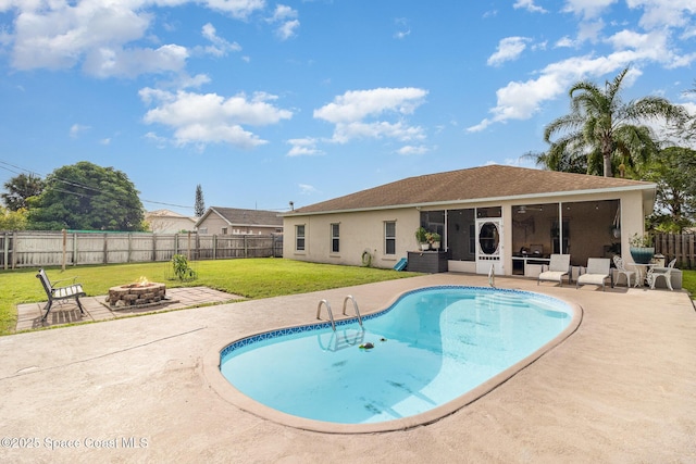 1510 Gardenton St NW, Palm Bay, FL 32907 - view of pool with a fire pit, a sunroom, a fenced backyard, and a patio area