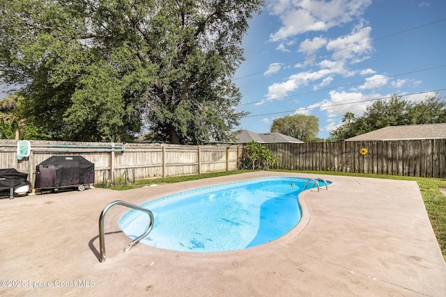 1510 Gardenton St NW, Palm Bay, FL 32907 - view of pool featuring a patio area, a fenced backyard, and grilling area