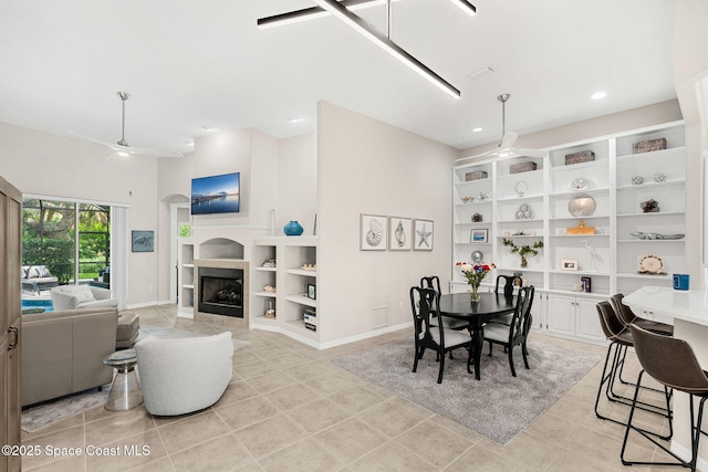 172 Whaler Dr, Melbourne Beach, FL 32951 - dining room featuring built in features, light tile patterned floors, a fireplace, and recessed lighting