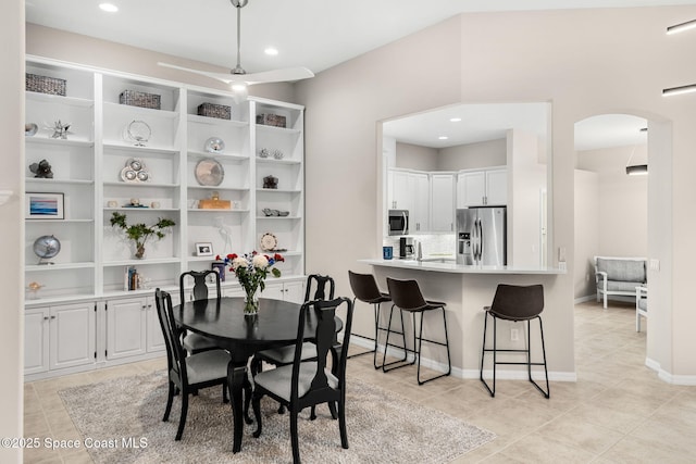 172 Whaler Dr, Melbourne Beach, FL 32951 - dining room with arched walkways, light tile patterned flooring, and recessed lighting