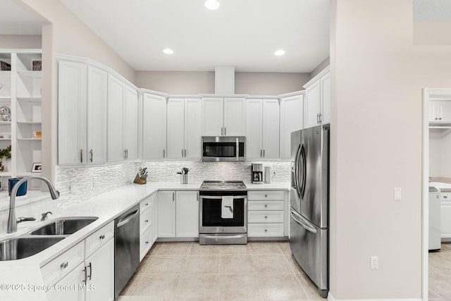 172 Whaler Dr, Melbourne Beach, FL 32951 - kitchen with appliances with stainless steel finishes, decorative backsplash, light countertops, white cabinetry, and recessed lighting