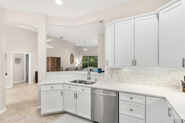 172 Whaler Dr, Melbourne Beach, FL 32951 - kitchen featuring stainless steel dishwasher, light countertops, decorative backsplash, white cabinetry, and ceiling fan