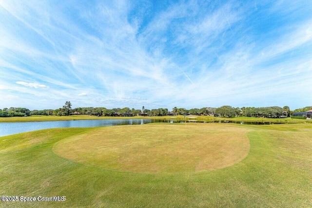 172 Whaler Dr, Melbourne Beach, FL 32951 - view of home's community featuring a water view, view of golf course, and a yard
