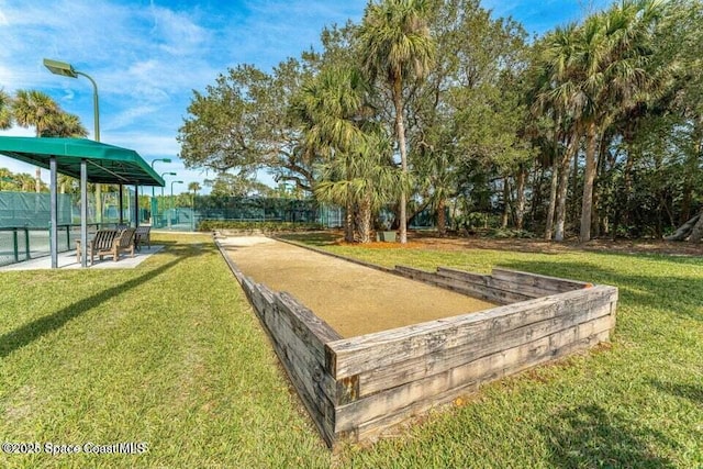 172 Whaler Dr, Melbourne Beach, FL 32951 - view of community featuring a game area and a yard