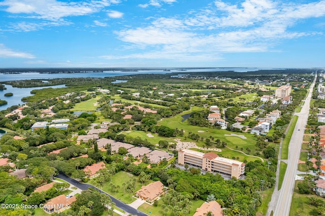 172 Whaler Dr, Melbourne Beach, FL 32951 - aerial view of property and surrounding area featuring a large body of water and nearby suburban area
