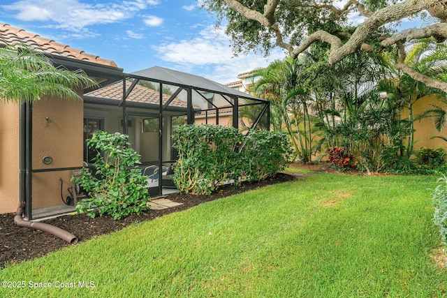 172 Whaler Dr, Melbourne Beach, FL 32951 - view of green lawn with glass enclosure