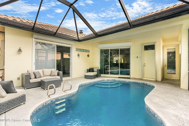 172 Whaler Dr, Melbourne Beach, FL 32951 - swimming pool with a patio, outdoor lounge area, and glass enclosure