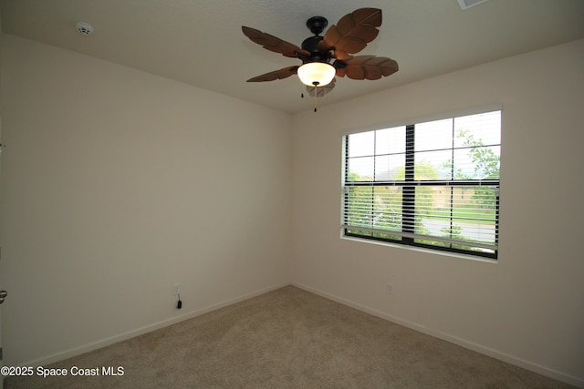 947 Remington Green Dr SE, Palm Bay, FL 32909 - unfurnished room featuring a smoke detector, light carpet, and ceiling fan