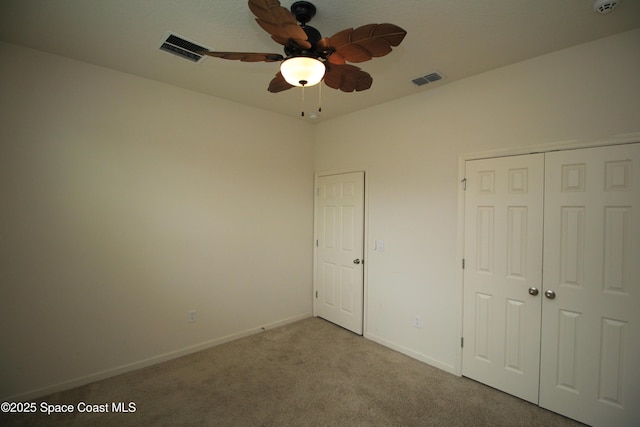947 Remington Green Dr SE, Palm Bay, FL 32909 - unfurnished bedroom featuring carpet floors, a closet, and ceiling fan