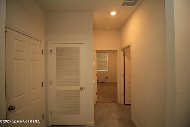 947 Remington Green Dr SE, Palm Bay, FL 32909 - hallway with light tile patterned floors and recessed lighting