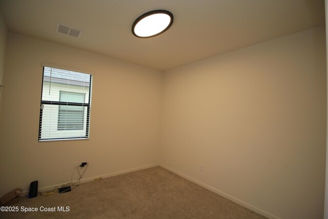 947 Remington Green Dr SE, Palm Bay, FL 32909 - carpeted spare room featuring baseboards
