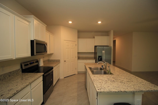 947 Remington Green Dr SE, Palm Bay, FL 32909 - kitchen featuring stainless steel appliances, white cabinetry, recessed lighting, and a kitchen island with sink