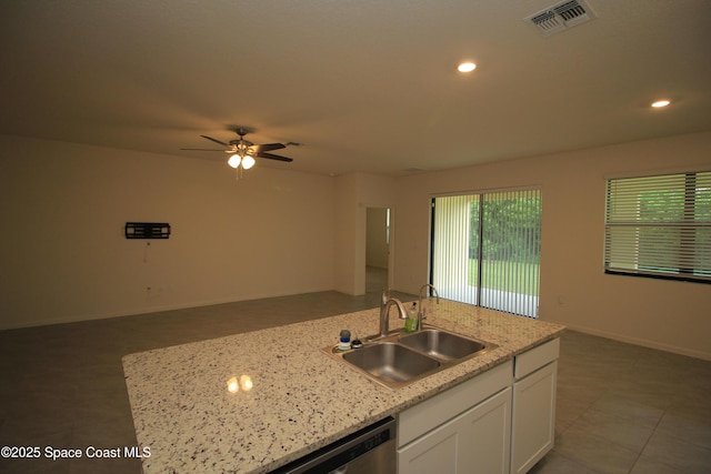 947 Remington Green Dr SE, Palm Bay, FL 32909 - kitchen featuring white cabinetry, a ceiling fan, open floor plan, recessed lighting, and light stone countertops