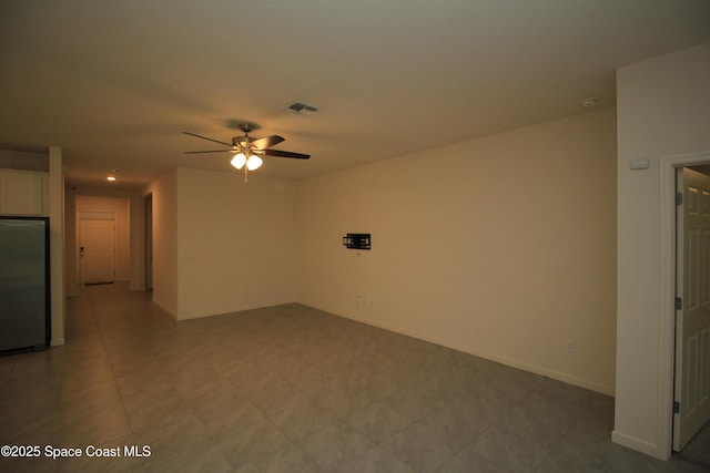 947 Remington Green Dr SE, Palm Bay, FL 32909 - unfurnished living room featuring a ceiling fan and baseboards