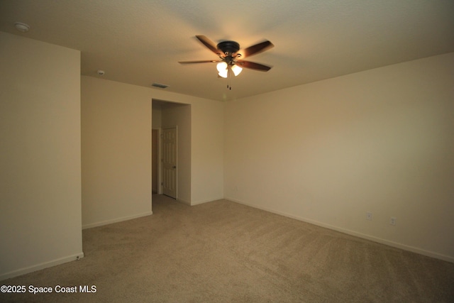 947 Remington Green Dr SE, Palm Bay, FL 32909 - spare room featuring ceiling fan, light colored carpet, and a smoke detector