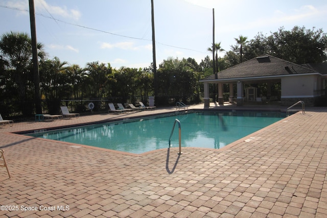 947 Remington Green Dr SE, Palm Bay, FL 32909 - community pool featuring a patio area