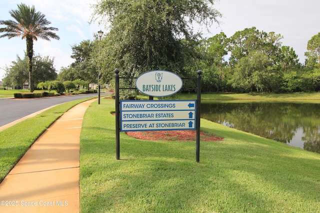 947 Remington Green Dr SE, Palm Bay, FL 32909 - surrounding community with a water view and a lawn