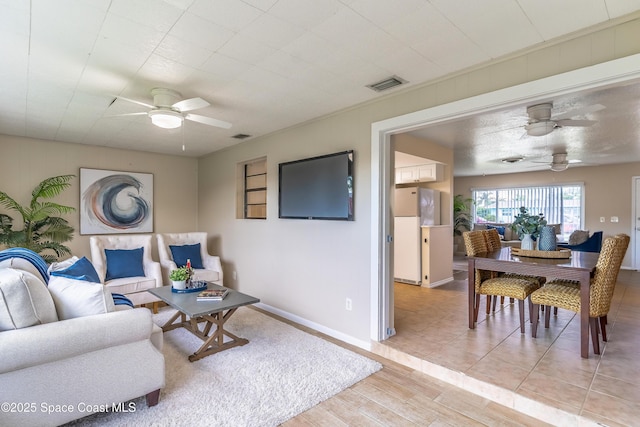1768 Hudson Cir S, Melbourne, FL 32935 - living area featuring a ceiling fan and light wood-type flooring